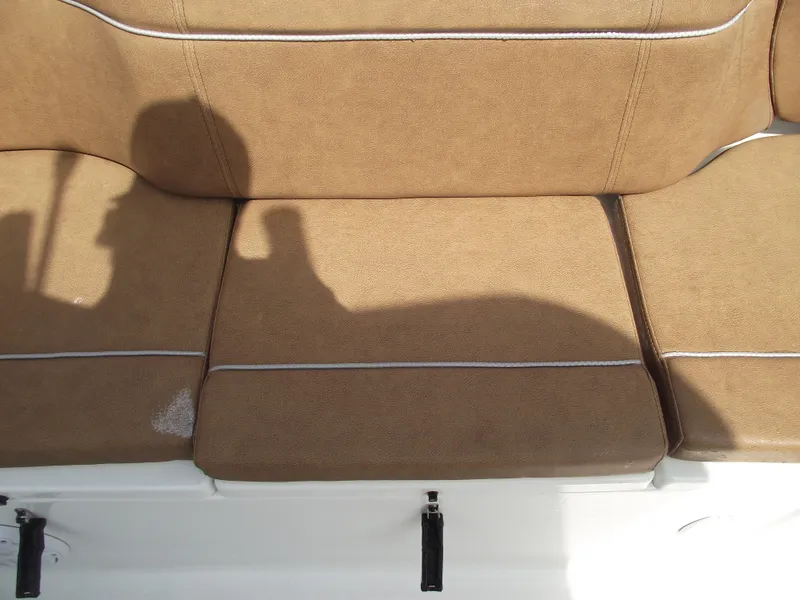 Slide: The Image of 2024 Sea Hunt Ultra 239 SE tan boat seating with shadow. - 43
