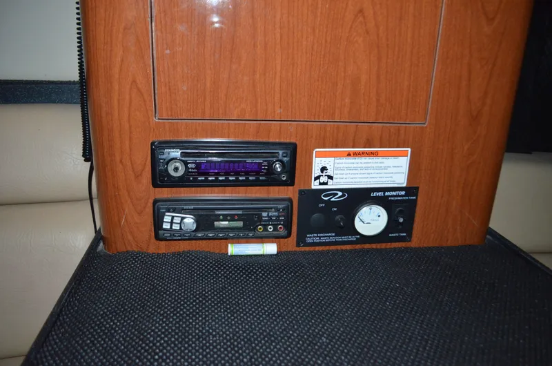 Slide: The Image of 2008 Regal 3360 Window Express cabin controls with stereo and level indicator. - 17