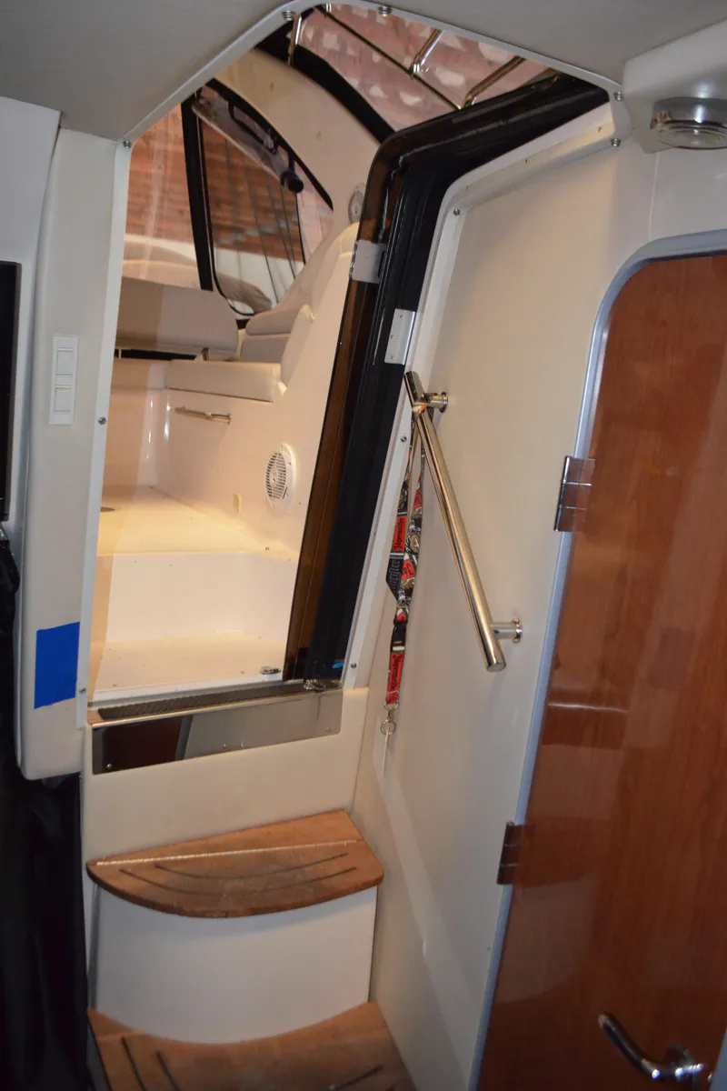 Slide: The Image of Interior stairs of 2008 Regal 3360 Window Express boat. - 19