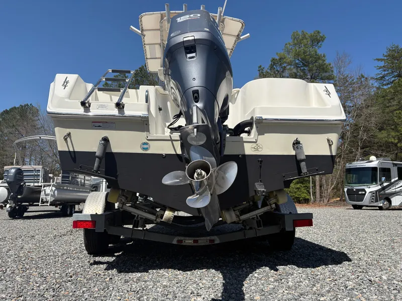 Slide: The Image of Rear view of 2011 Sailfish 218 boat on trailer, featuring outboard motor. - 3