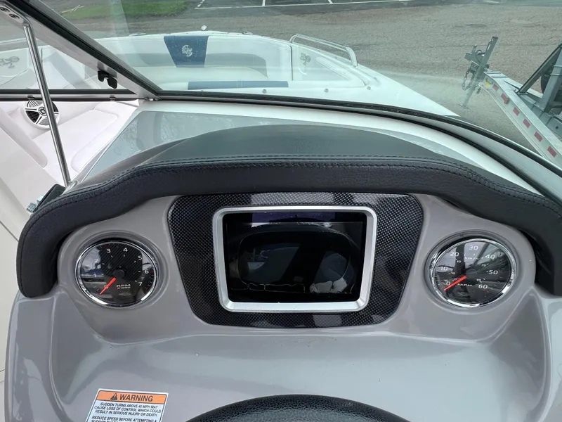 Slide: The Image of Dashboard of 2019 Chaparral 23 H2O Surf boat with gauges and controls. - 10