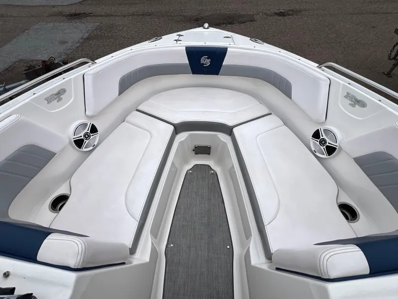Slide: The Image of 2019 Chaparral 23 H2O Surf boat interior with white and blue seating. - 14