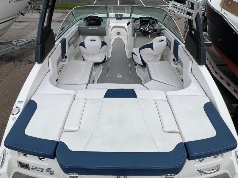 Slide: The Image of 2019 Chaparral 23 H2O Surf boat interior with white and blue seating. - 3