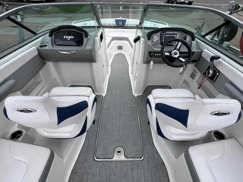 Slide: The Image of 2019 Chaparral 23 H2O Surf boat interior with modern dashboard and seating. - 8