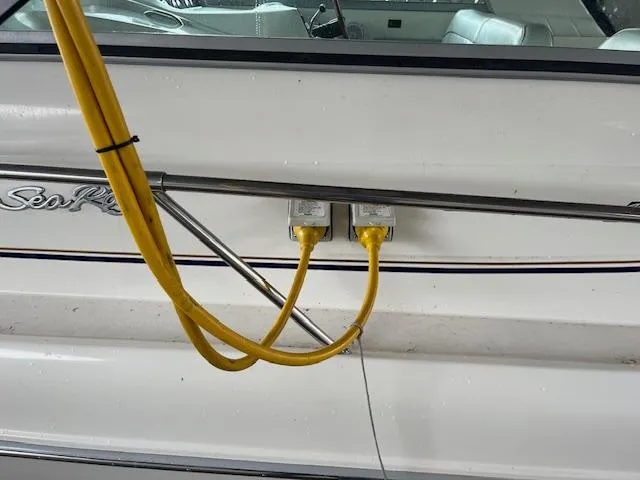 Slide: The Image of Yellow power cables connected to a 1996 Sea Ray 330 Sundancer boat. - 3