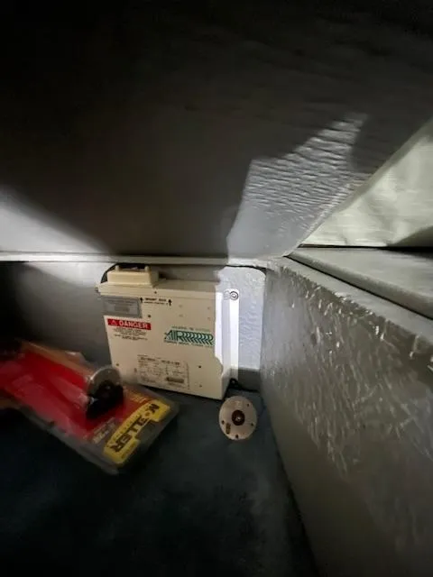 Slide: The Image of Electrical components inside a 1996 Sea Ray 330 Sundancer boat compartment. - 30