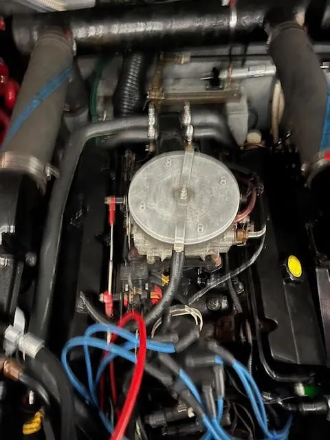 Slide: The Image of Engine compartment of a 1996 Sea Ray 330 Sundancer boat, showing wiring and components. - 34