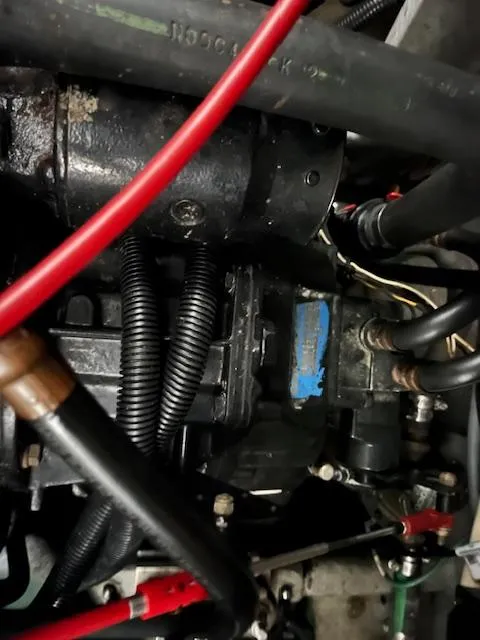 Slide: The Image of Engine components of a 1996 Sea Ray 330 Sundancer with visible wiring and hoses. - 37