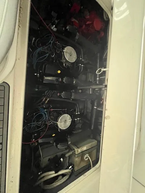 Slide: The Image of Engine compartment of a 1996 Sea Ray 330 Sundancer boat, showing mechanical components and wiring. - 39