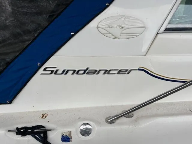 Slide: The Image of Sea Ray 330 Sundancer 1996 boat with logo and nameplate detail. - 4
