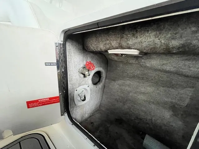 Slide: The Image of Interior compartment of a 1996 Sea Ray 330 Sundancer boat, showing fresh water access. - 8