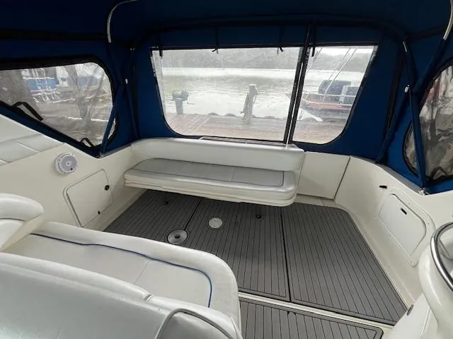Slide: The Image of Interior view of 1996 Sea Ray 330 Sundancer boat with seating and windows. - 9