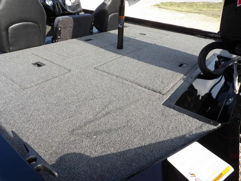 Slide: The Image of 2025 Crestliner XFC 189 boat interior with spacious carpeted deck and seating. - 10