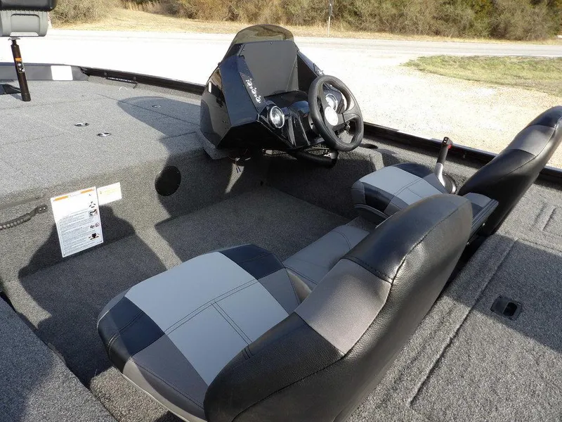 Slide: The Image of 2025 Crestliner XFC 189 boat interior with steering wheel and seating. - 12