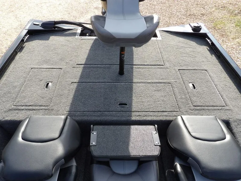 Slide: The Image of 2025 Crestliner XFC 189 boat interior with gray carpet and seating arrangement. - 13