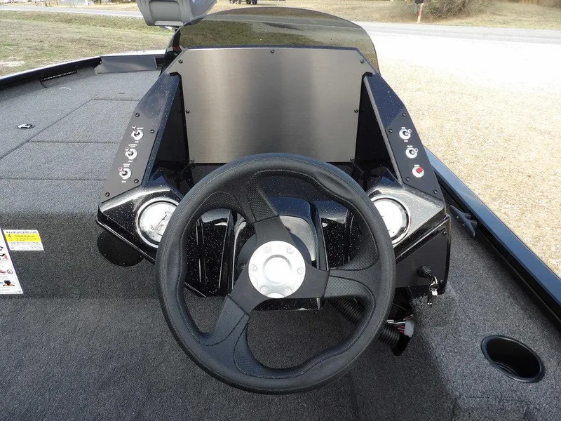 Slide: The Image of 2025 Crestliner XFC 189 boat dashboard with steering wheel and control panel. - 15