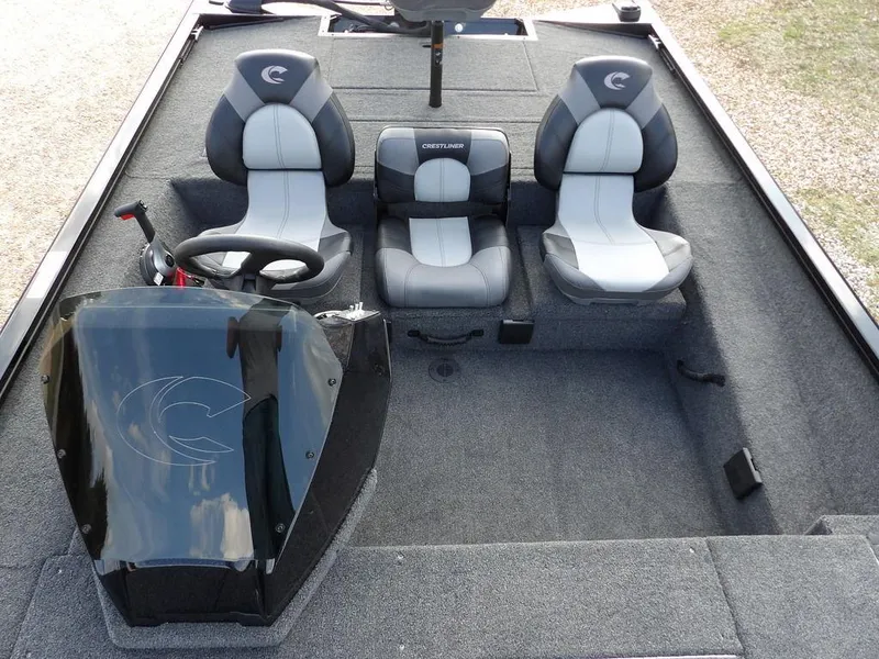 Slide: The Image of 2025 Crestliner XFC 189 boat interior with three seats and steering console. - 22
