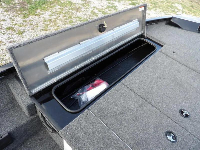 Slide: The Image of 2025 Crestliner XFC 189 boat storage compartment with open lid, showcasing interior space. - 23