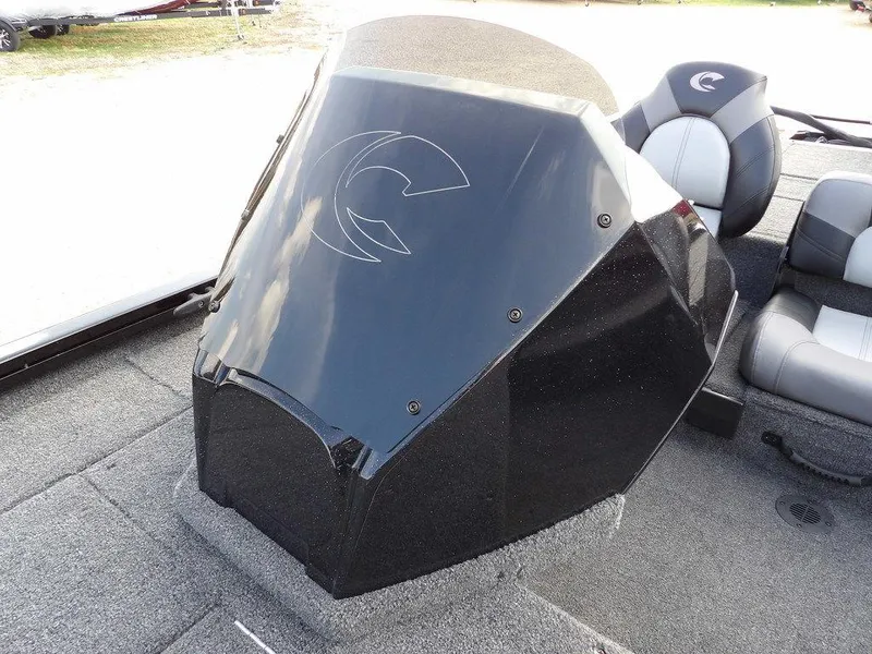 Slide: The Image of 2025 Crestliner XFC 189 boat console with sleek black design and comfortable seating. - 24
