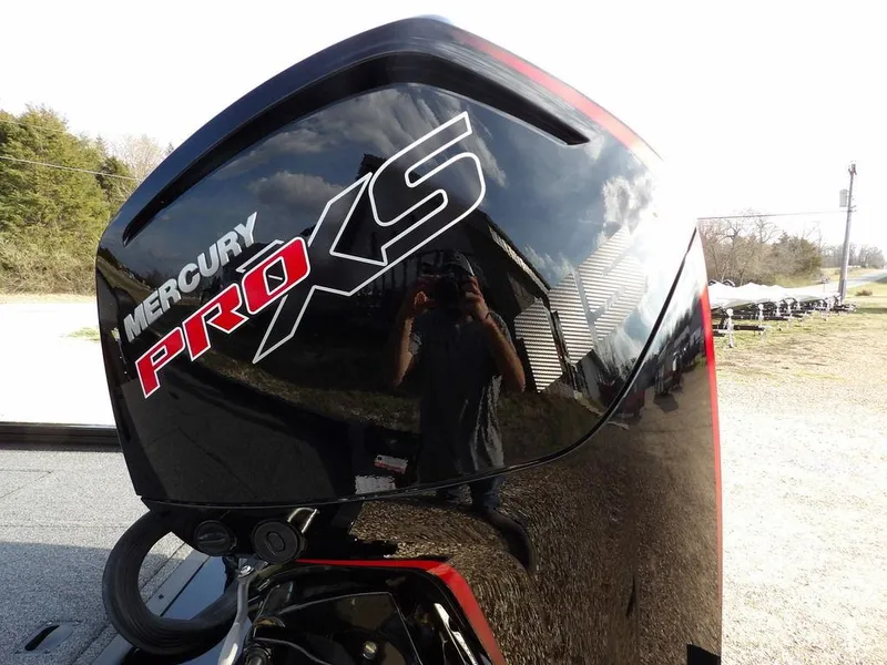 Slide: The Image of Mercury Pro XS engine on 2025 Crestliner XFC 189 boat, reflecting outdoor scenery. - 30