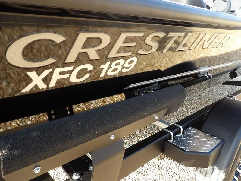 Slide: The Image of 2025 Crestliner XFC 189 boat on trailer, close-up view of logo and model name. - 34