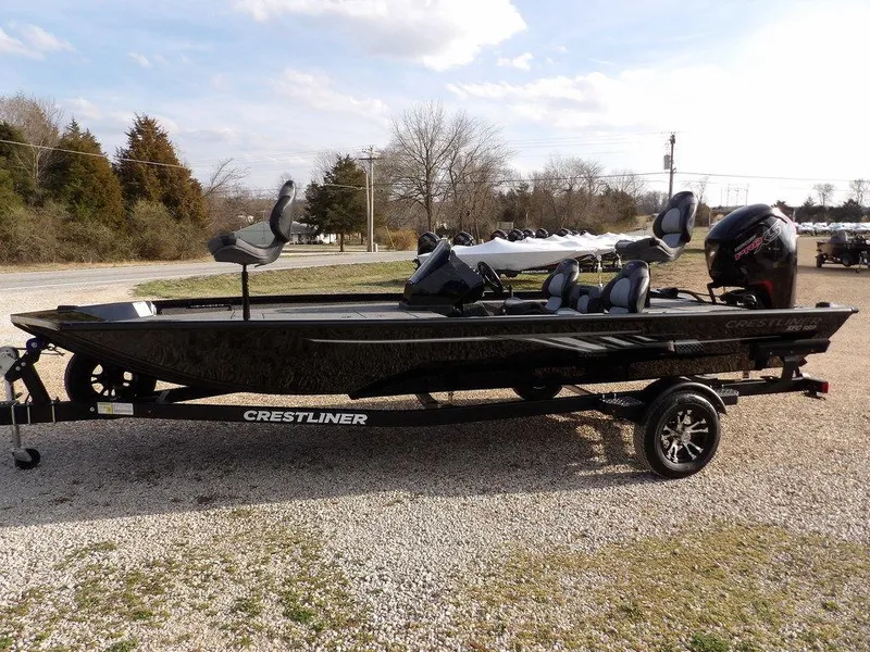 Slide: The Image of 2025 Crestliner XFC 189 fishing boat on trailer, parked outdoors. - 7