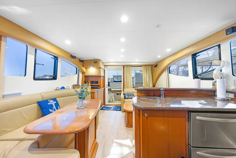 Slide: The Image of Luxurious interior of a 2007 Silverton 45 Convertible yacht with elegant furnishings and modern amenities. - 10