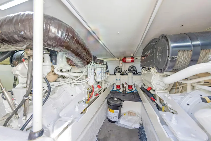 Slide: The Image of Engine room of 2007 Silverton 45 Convertible yacht, showcasing mechanical components and systems. - 28