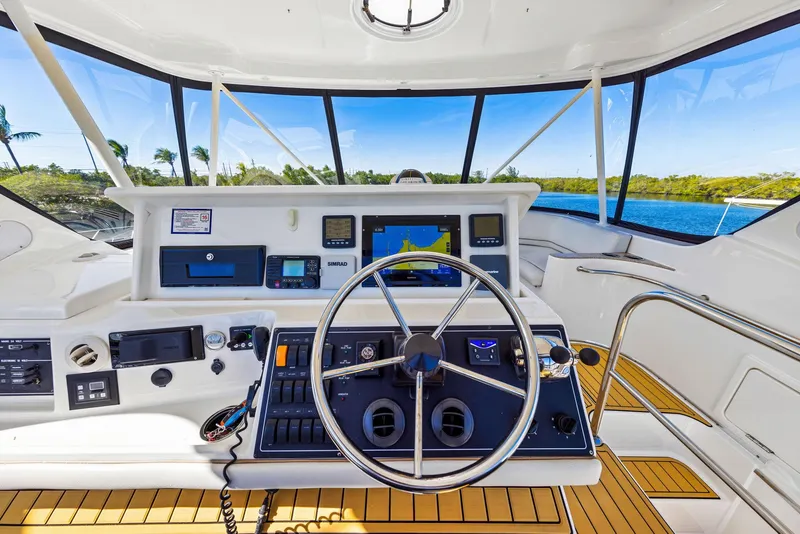 Slide: The Image of Helm of 2007 Silverton 45 Convertible yacht with navigation equipment and panoramic view. - 29