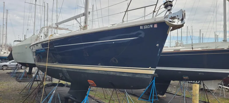 Slide: The Image of 2001 Hunter 460 sailboat on stands in a boatyard. - 1