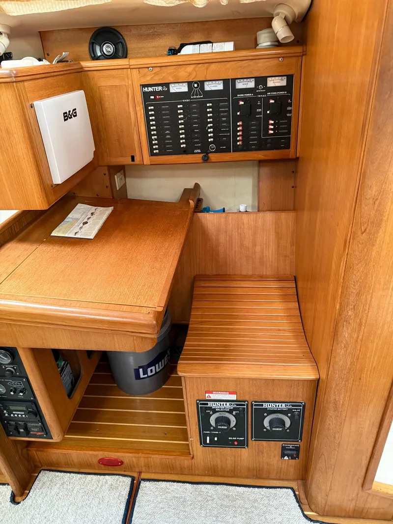 Slide: The Image of Control panel and wooden interior of a 2001 Hunter 460 sailboat. - 12