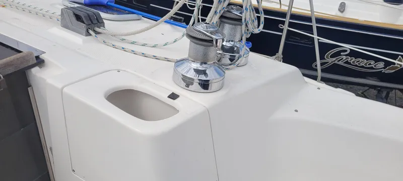 Slide: The Image of Deck of a 2001 Hunter 460 sailboat with winches and ropes. - 9