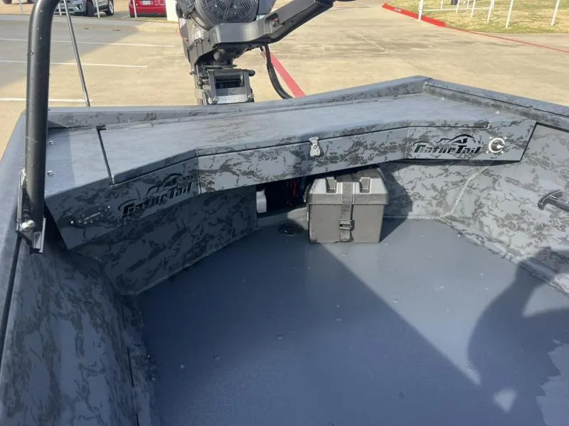 Slide: The Image of 2025 Gator Tail 17/54 EXTREME SERIES boat interior with camouflage design and storage compartment. - 12