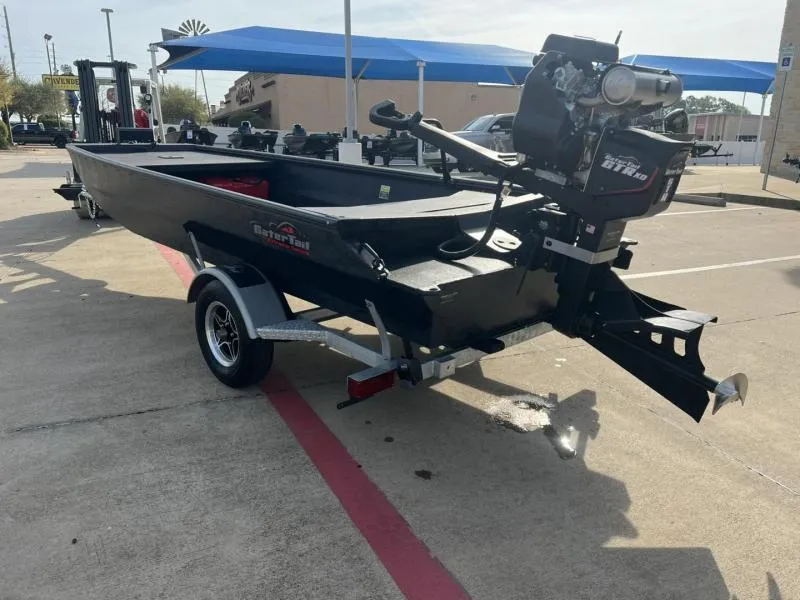 Slide: The Image of 2025 Gator Tail 17/54 EXTREME SERIES boat on trailer in parking lot. - 3