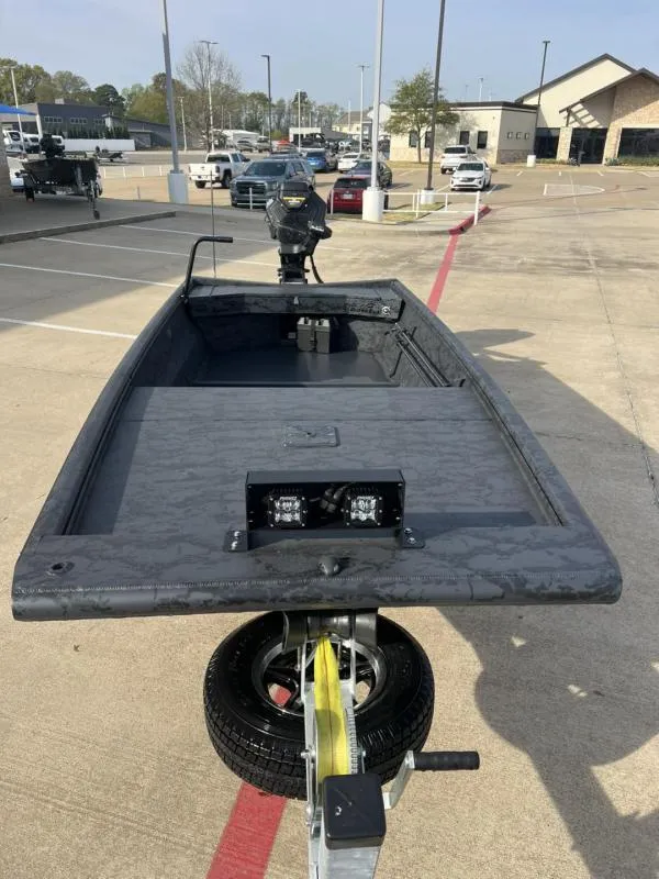 Slide: The Image of 2025 Gator Tail 17/54 EXTREME SERIES boat on trailer in parking lot. - 8