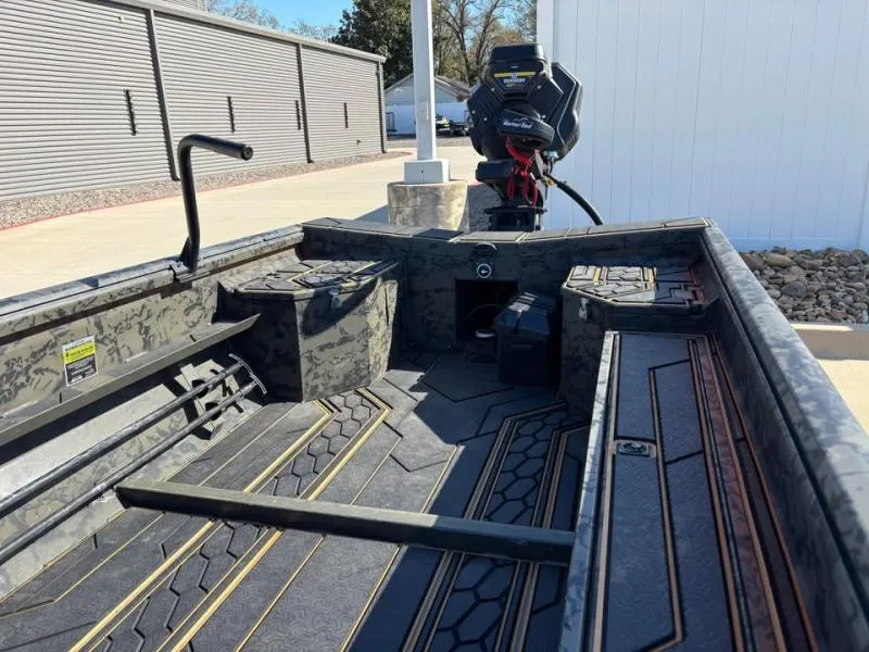 Slide: The Image of 2025 Gator Tail 17/50 MID-DECK SAVAGE SERIES boat interior with camo design and motor. - 10