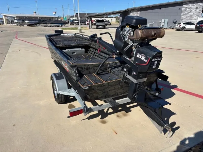 Slide: The Image of 2025 Gator Tail 17/50 MID-DECK SAVAGE SERIES boat on trailer in parking lot. - 5