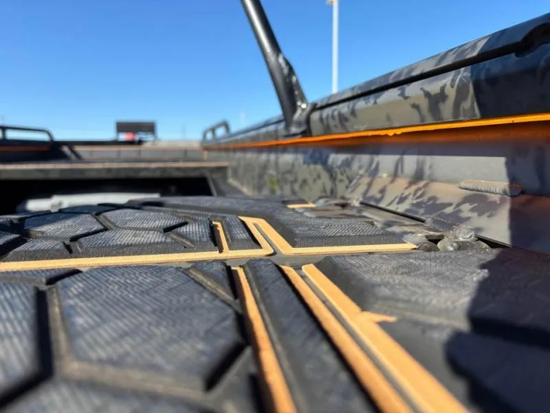 Slide: The Image of Close-up of 2025 Gator Tail 17/50 MID-DECK SAVAGE SERIES boat deck with textured surface. - 8