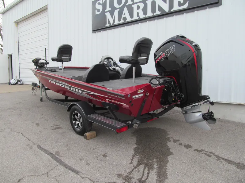 Slide: The Image of 2020 Tracker Pro Team 190 TX Tournament Edition boat parked outside a marine store. - 3