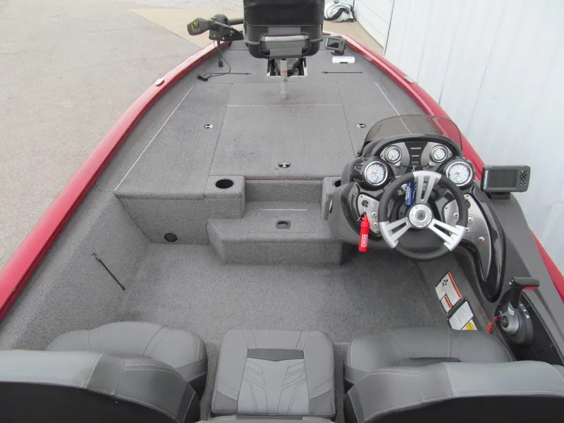Slide: The Image of 2020 Tracker Pro Team 190 TX Tournament Edition boat interior with steering console and seating. - 5