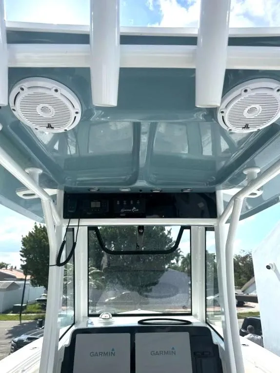 Slide: The Image of 2021 Sea Hunt Gamefish 27 helm with Garmin electronics and overhead speakers. - 10