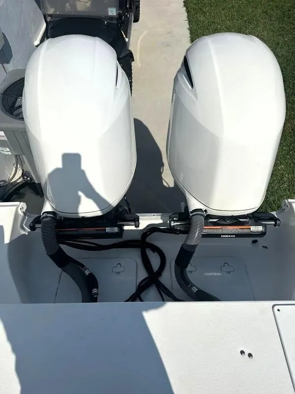 Slide: The Image of 2021 Sea Hunt Gamefish 27 boat with dual outboard engines, viewed from above. - 12
