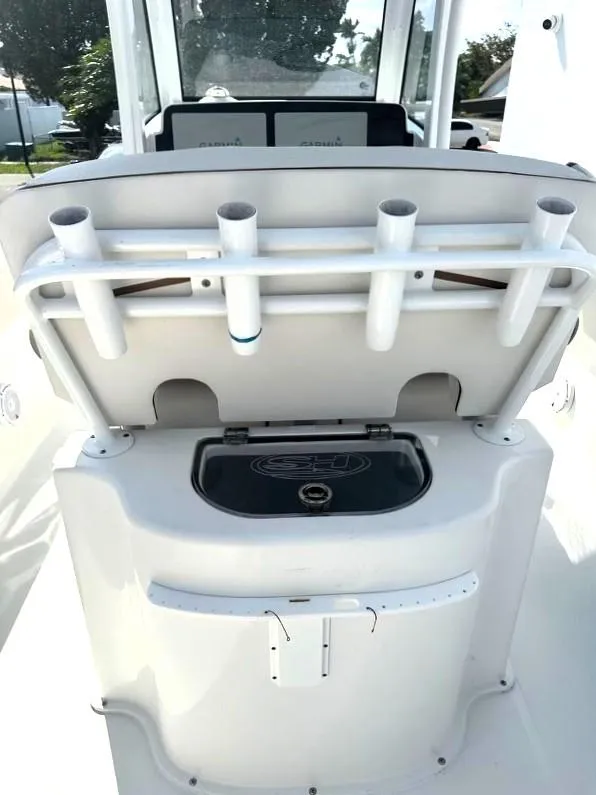 Slide: The Image of 2021 Sea Hunt Gamefish 27 with Coffin Box, featuring rod holders and storage compartment. - 14
