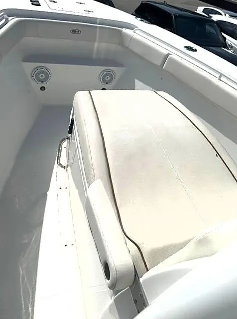 Slide: The Image of 2021 Sea Hunt Gamefish 27 with Coffin Box, featuring spacious seating and modern design. - 7