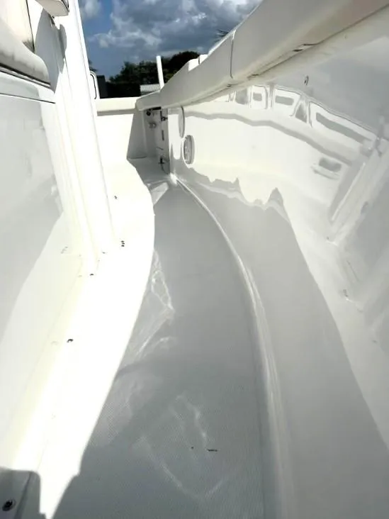 Slide: The Image of 2021 Sea Hunt Gamefish 27 interior, showcasing sleek white design and spacious layout. - 9