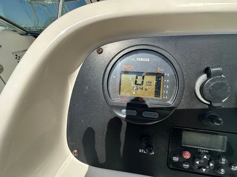 Slide: The Image of 2014 Robalo R227 Dual Console dashboard with Garmin navigation system and control panel. - 19