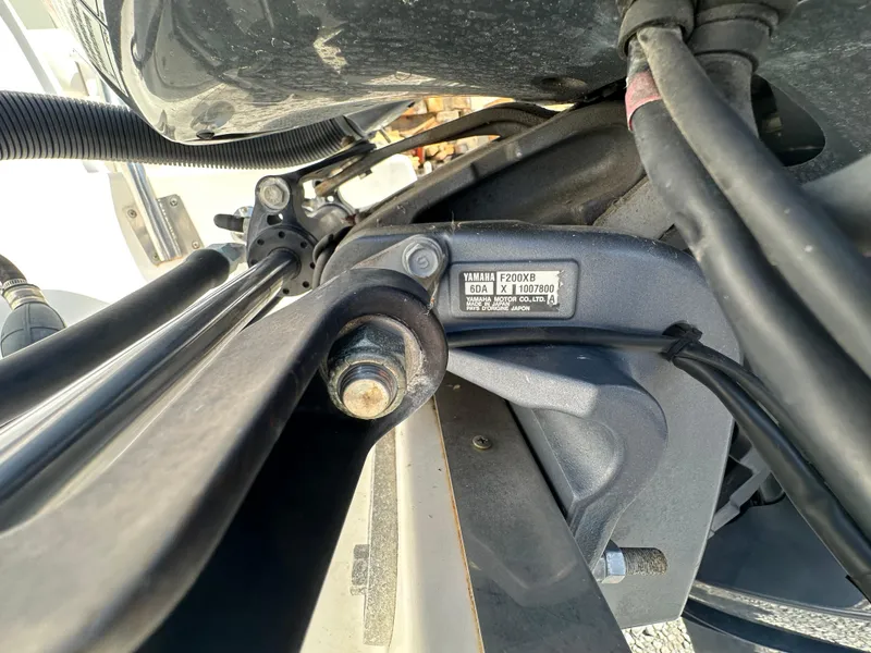 Slide: The Image of Close-up of a 2014 Robalo R227 Dual Console boat engine component. - 3