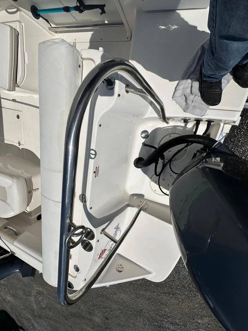 Slide: The Image of 2014 Robalo R227 Dual Console boat interior with steering wheel and seating. - 30