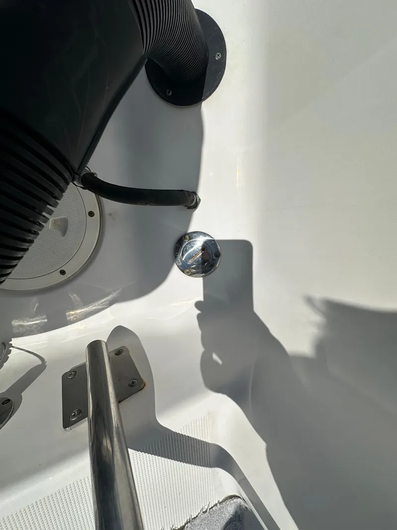 Slide: The Image of 2014 Robalo R227 Dual Console interior detail with metal and rubber components. - 32