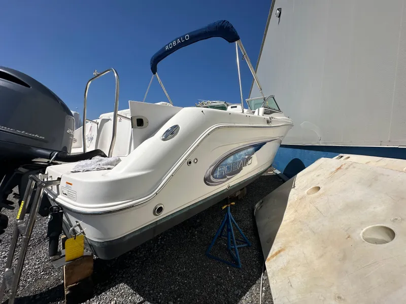 Slide: The Image of 2014 Robalo R227 Dual Console boat on trailer, outdoor storage. - 5